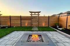 Interlocking patio, fire-feature, outdoor lighting, custom garden box, custom wood fence, custom torii gate