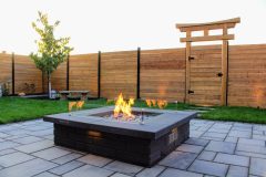 Interlocking patio, fire-feature, outdoor lighting, custom garden box, custom wood fence, custom torii gate